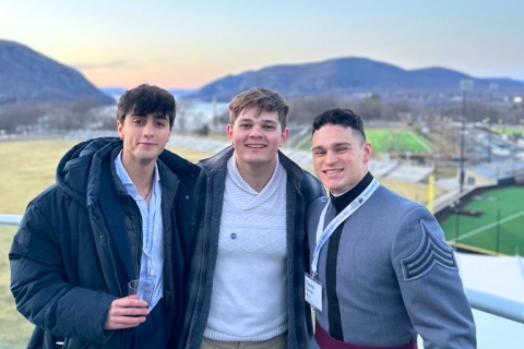 Wesley Lanter (center) and two other conference attendees with a view outside of the West Point Leadership Center