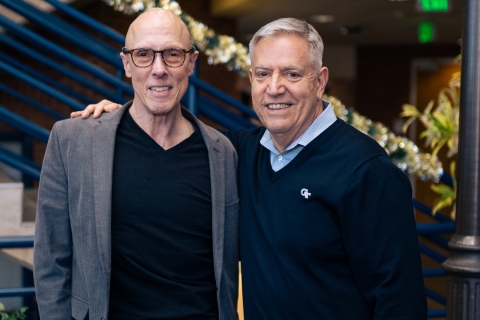 Wes Wynens (left) and Dean of Students, John M. Stein (right) smiling at the camera